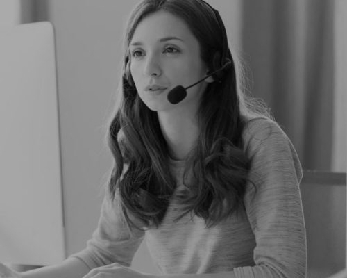 Businesswoman in headset call center agent consulting participating video conference